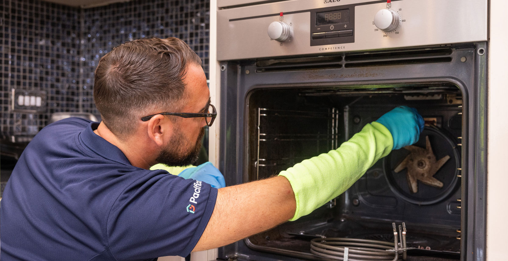 Pacifica engineer testing oven fan during oven repair service