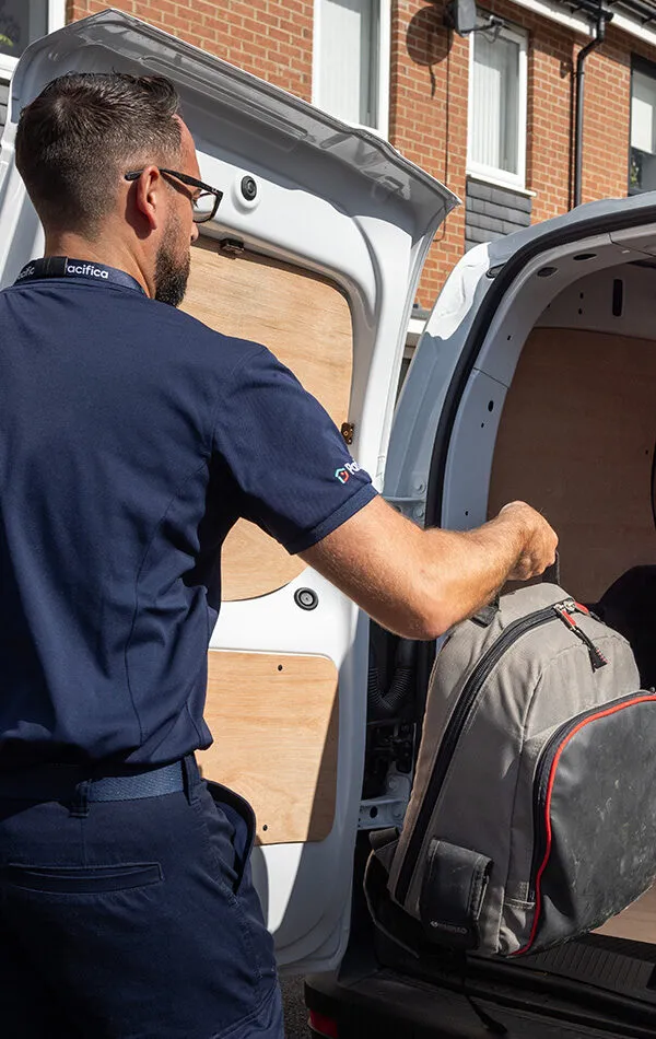 Pacifica engineer removing bag from van